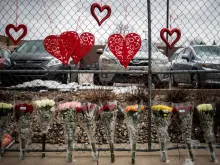Flowers at a fence outside the King Soopers in Boulder, Colorado where a gunman opened fire on March 23, 2021. 